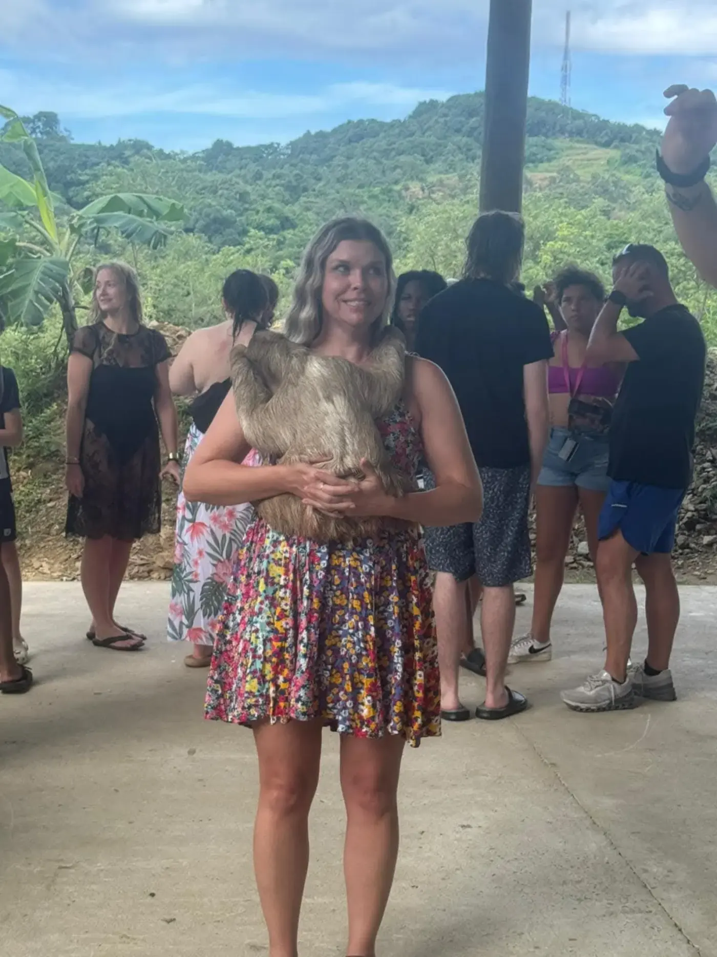 Guest enjoying sloth experience at Roatán wildlife stop